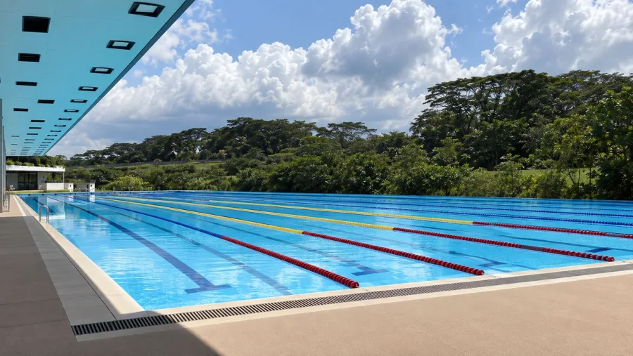 AI-generated impression of an outdoor 50-metre competition swimming pool with lane ropes at Punggol Swimming Complex